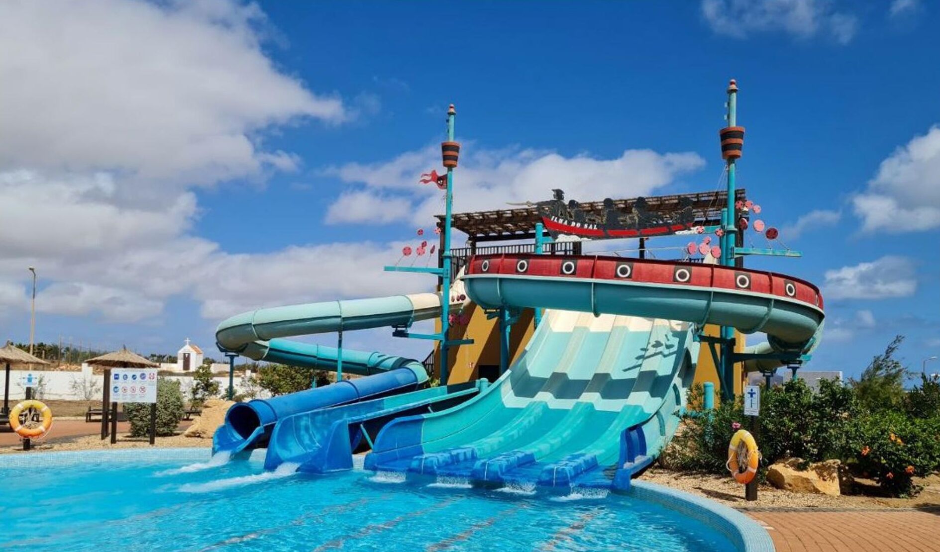 A water park with a large wave pool and slides.