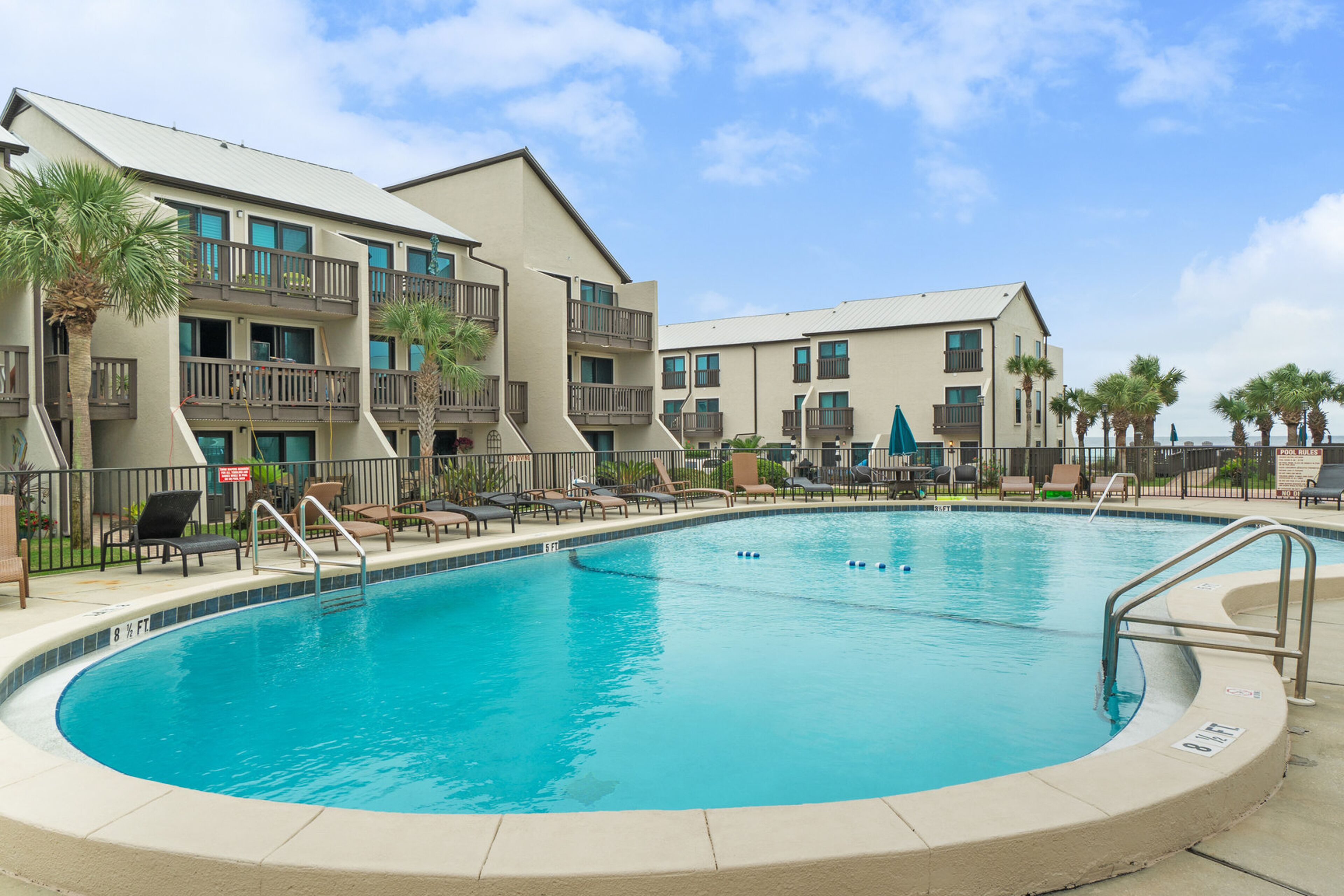 Three-story condo in beachfront complex with patios, balconies, pool & hot tub