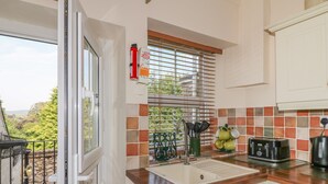 A kitchen with a window, a sink, and a toaster. - Longstone View (Bakewell)