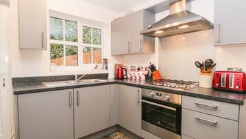 Fridge, electric kettle, toaster, cookware/dishes/utensils