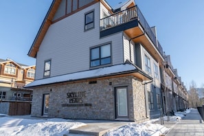 Experience the perfect blend of contemporary and traditional styles at Skyline Peaks, featuring large windows and a spacious balcony.