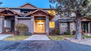 A two-story house with a front porch, a garage, and a driveway. - HOT TUB, Eagle Crest Condo on Golf Course, DOGS OK (Redmond)