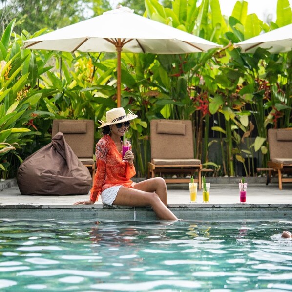 Outdoor pool, open 10:00 AM to 9:00 PM, pool umbrellas, pool loungers