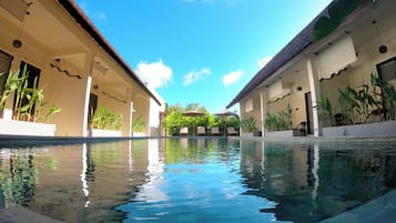 Outdoor pool, open 10:00 AM to 9:00 PM, pool umbrellas, pool loungers