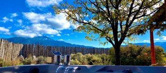 Colorful dog-friendly home with sweeping views, a private hot tub, & large yard