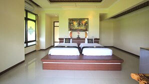 A large bedroom with two beds, a ceiling fan, and a painting on the wall. - SUARA SIDHI Villa Ubud Bali (Ubud)