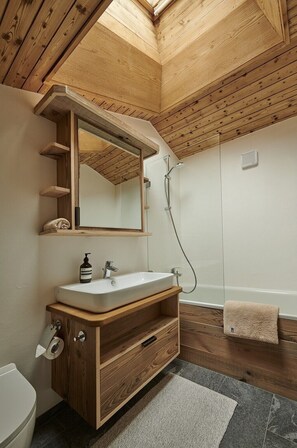 Bathtub, hair dryer, towels