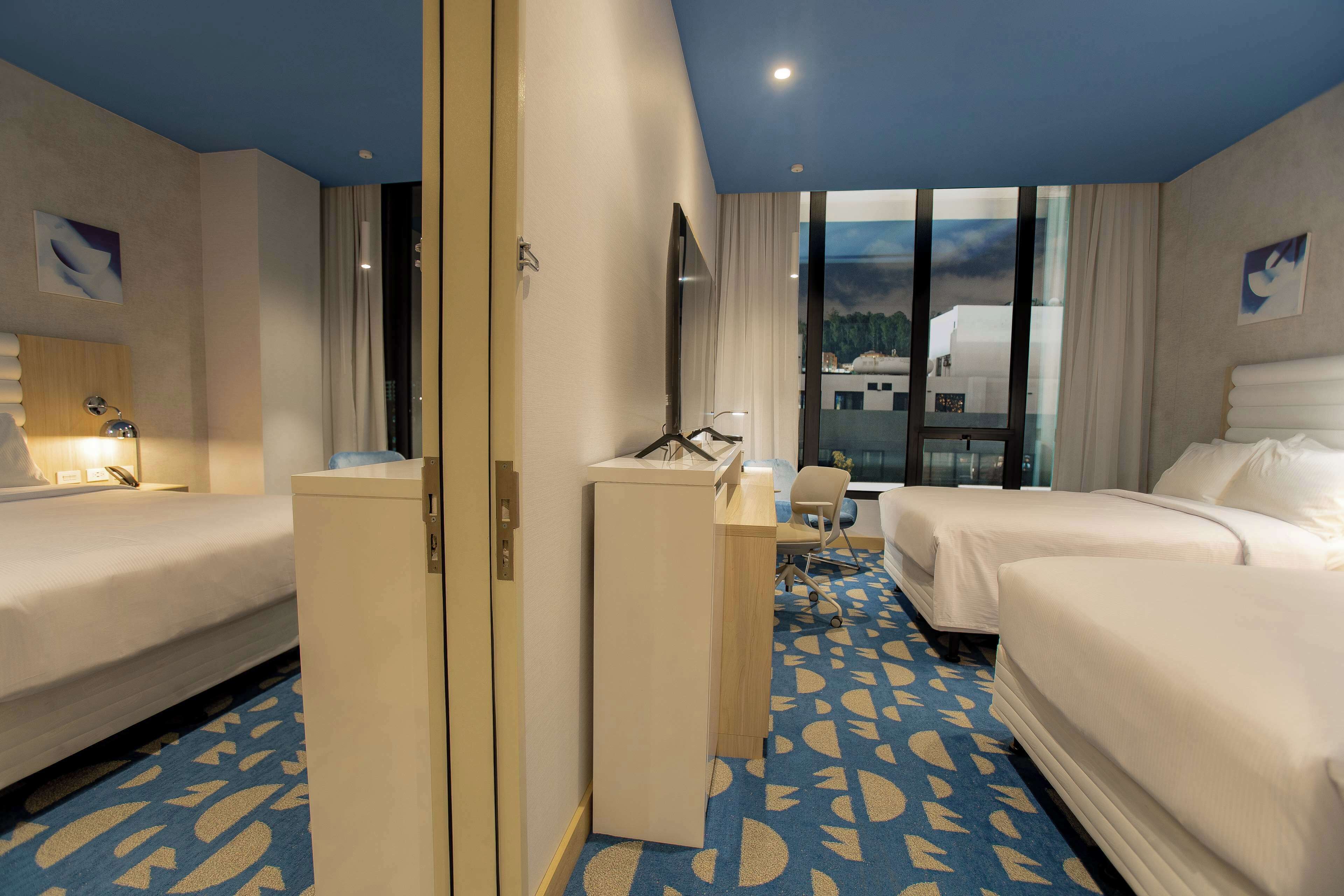 Premium bedding, down duvets, desk, laptop workspace