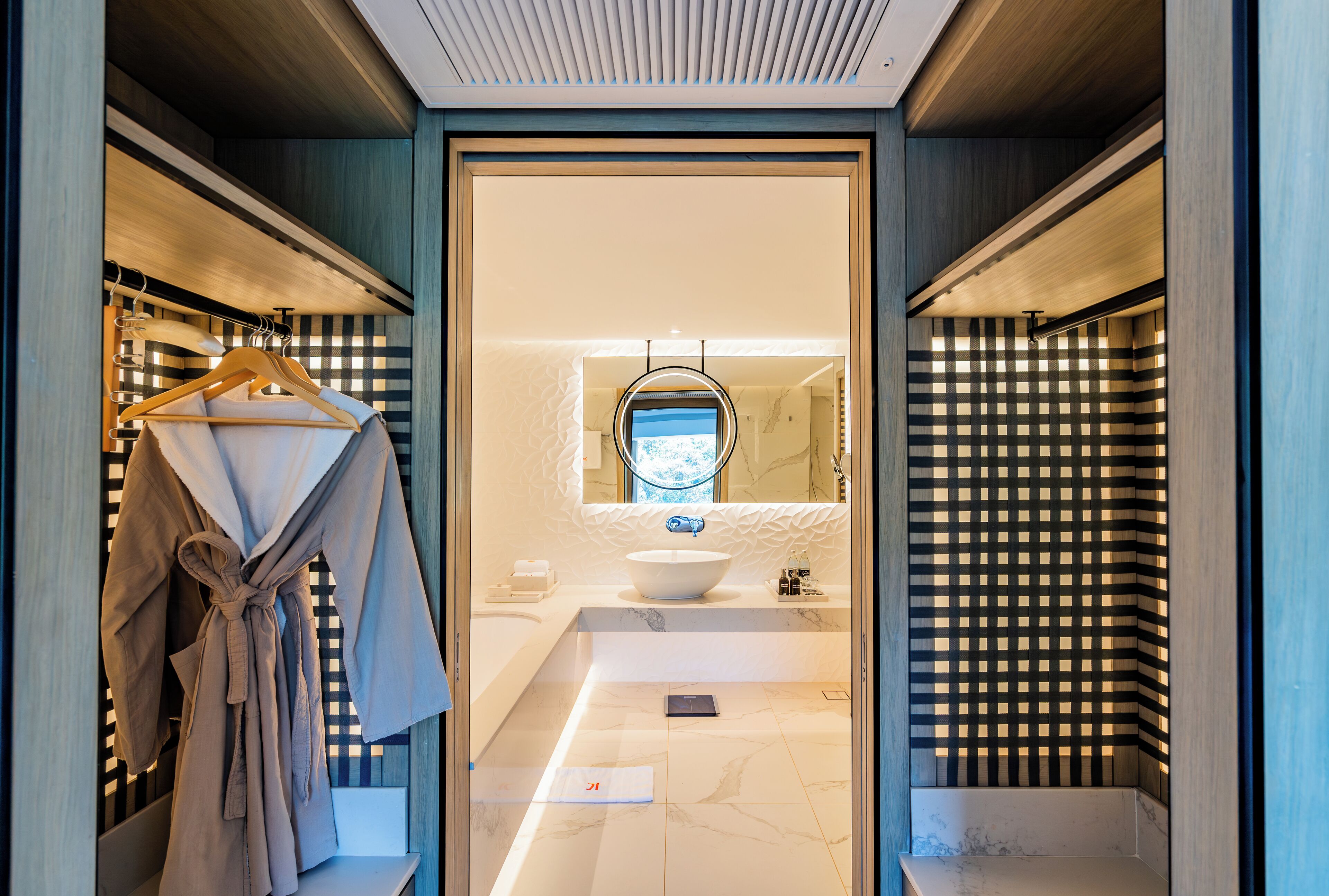 Deep soaking tub, rainfall showerhead, designer toiletries, hair dryer