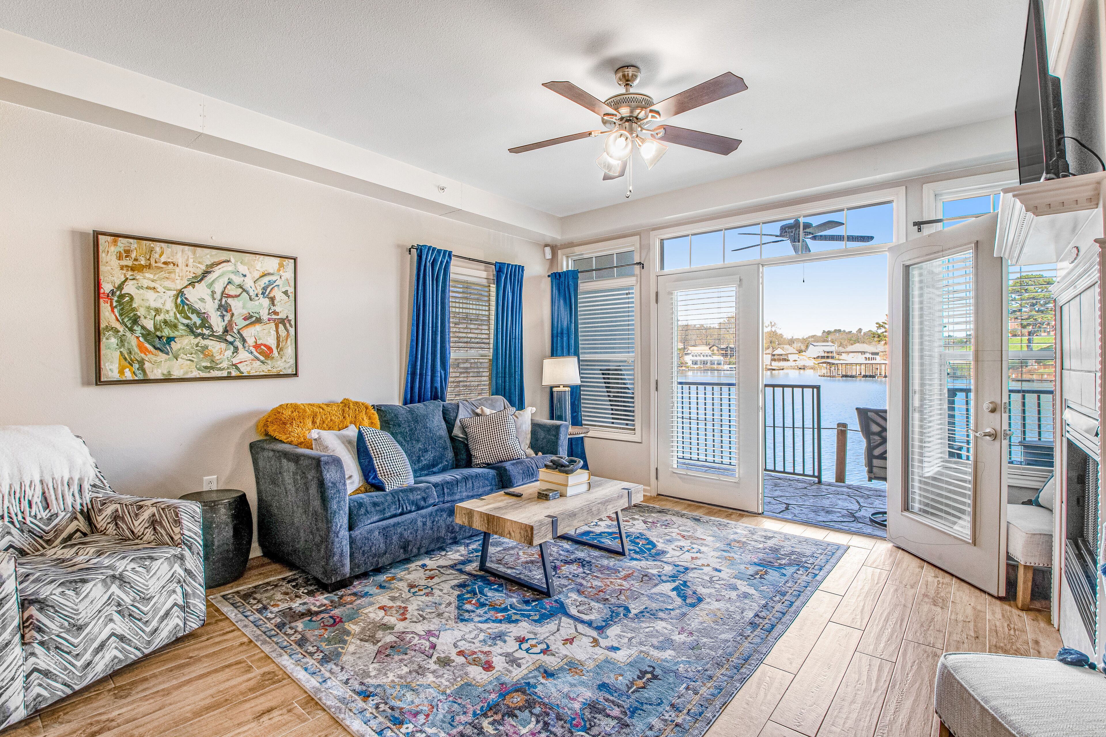 Lakefront condo with dock, lake views, firepit, dock, & fireplace - dogs OK