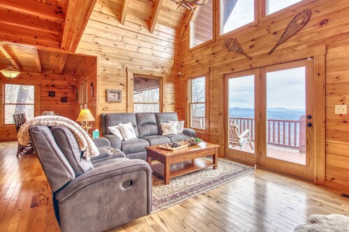 Rustic mountain-view home with deck, fire pit, hot tub, fireplace, & game room