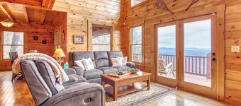 Rustic mountain-view home with deck, fire pit, hot tub, fireplace, & game room