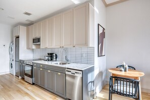 Fridge, microwave, oven, stovetop - Classic East Village 2BR w/ W/D, Gym & Elevator, nr cafes, by Blueground (Downtown)