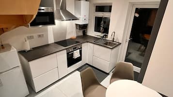Microwave, oven, dining tables