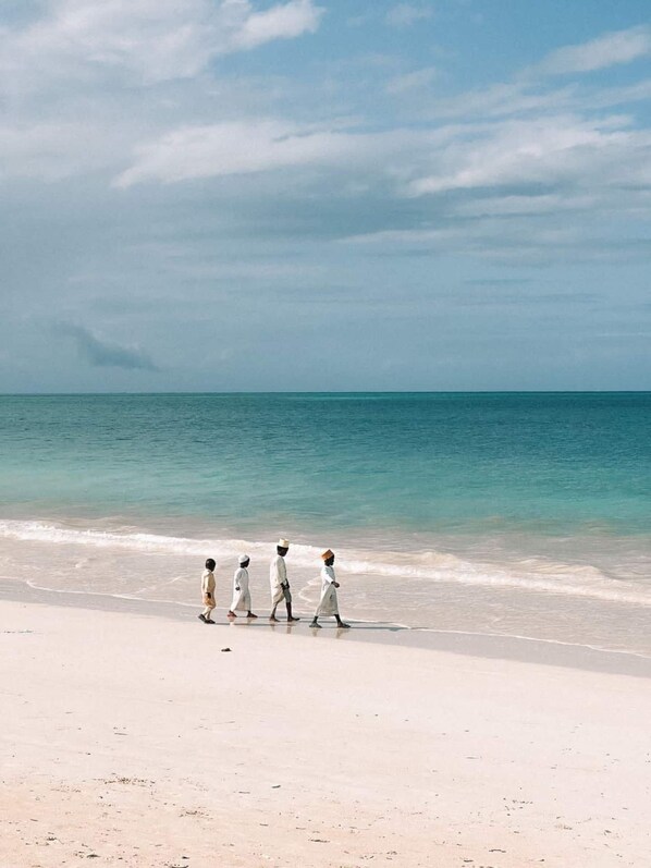 On the beach, sun loungers, beach towels