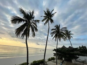 On the beach, sun loungers, beach towels