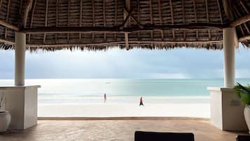 On the beach, sun loungers, beach towels