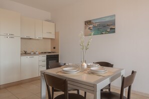Standard Apartment, Multiple Bedrooms (Le Fontane Bilo 4P 4 Km From The) | Private kitchen | Oven, stovetop, toaster, cookware/dishes/utensils