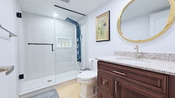 Shower, hair dryer, towels, soap