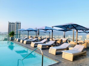 Outdoor pool, pool loungers - WINK HOTEL DANANG RIVERSIDE, Unscripted by Hyatt (Da Nang)