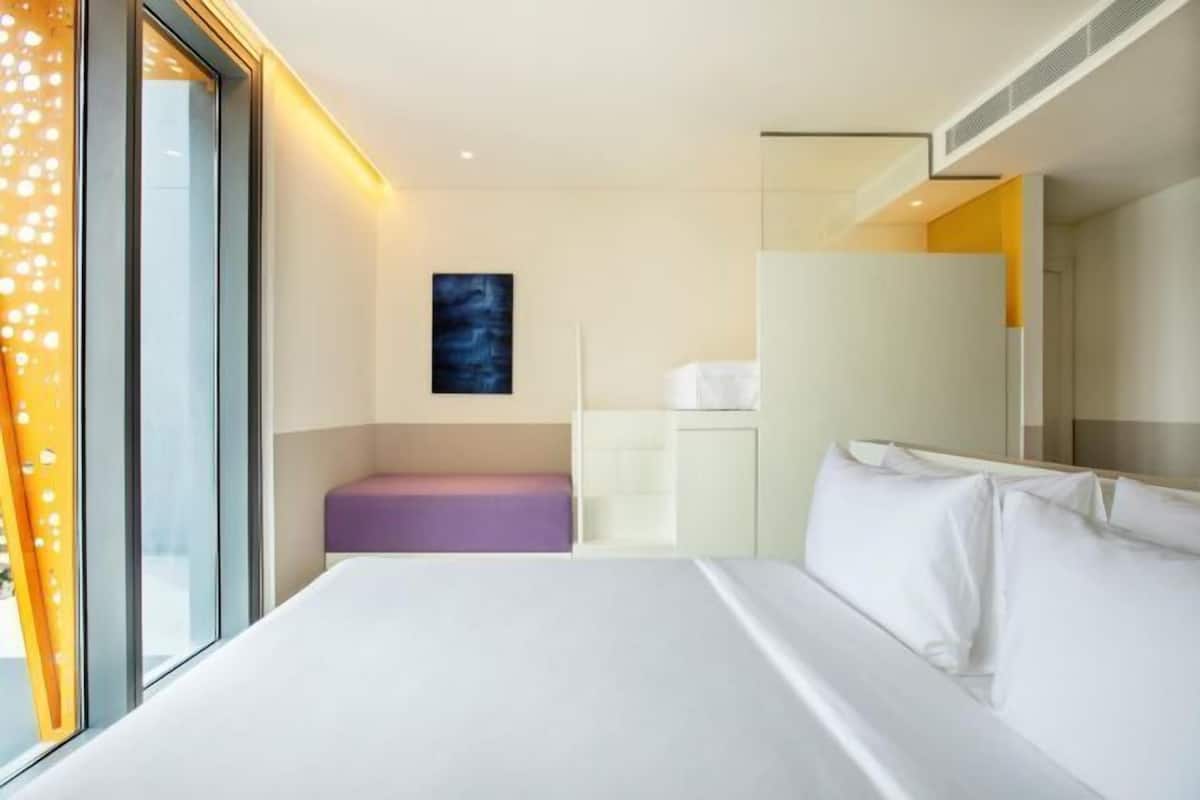 Premium bedding, down comforters, Select Comfort beds, minibar