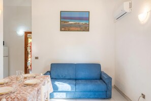Standard Apartment, Multiple Bedrooms (Residenze Gallura Trilo 6) | Living area | 21-inch TV with cable channels - Residenze Gallura Trilo 6 (San Teodoro)