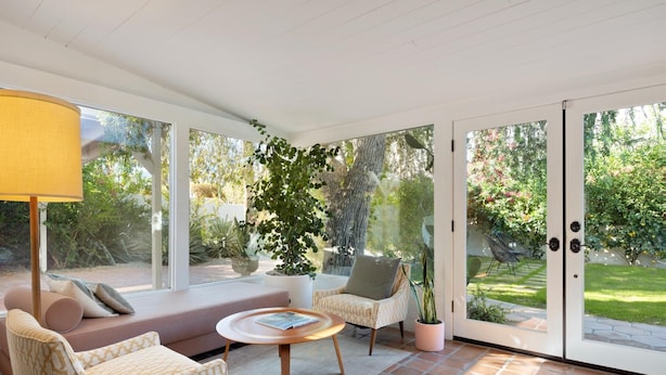 A sunlit patio with a sofa, chairs, and a table. - Dog-Friendly Bungalow with Private Pool (Palm Springs)