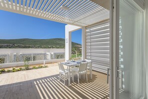 Outdoor dining - Capo Falcone Apartments (Stintino)