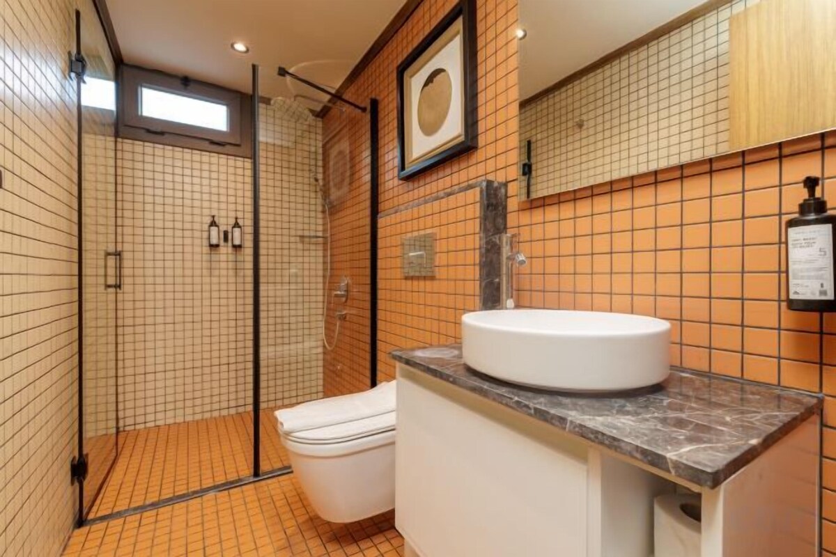 Bathroom | Shower, rainfall showerhead, hair dryer, slippers