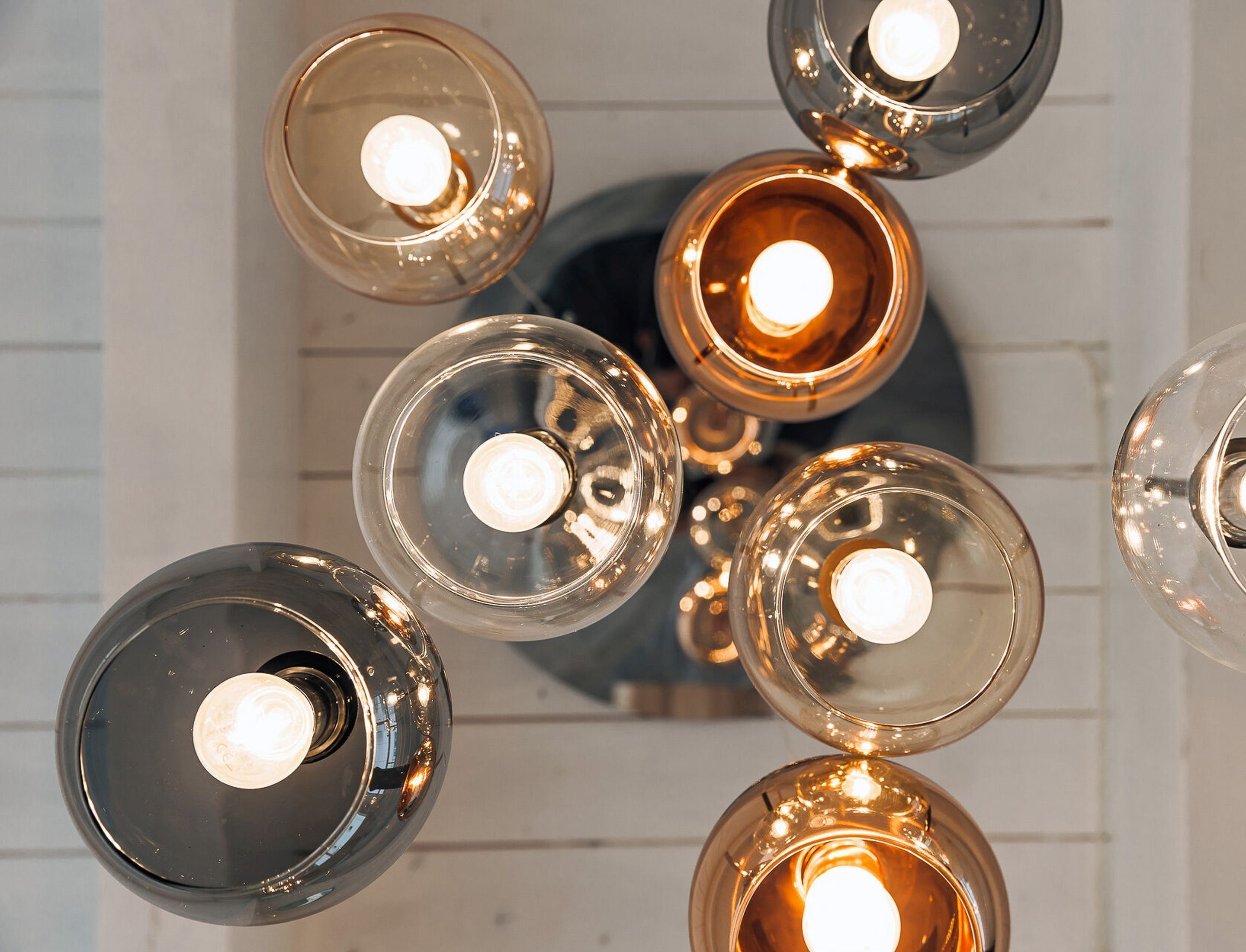 A ceiling with multiple spherical light fixtures.