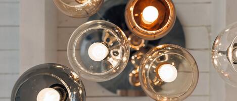 A ceiling with multiple spherical light fixtures.