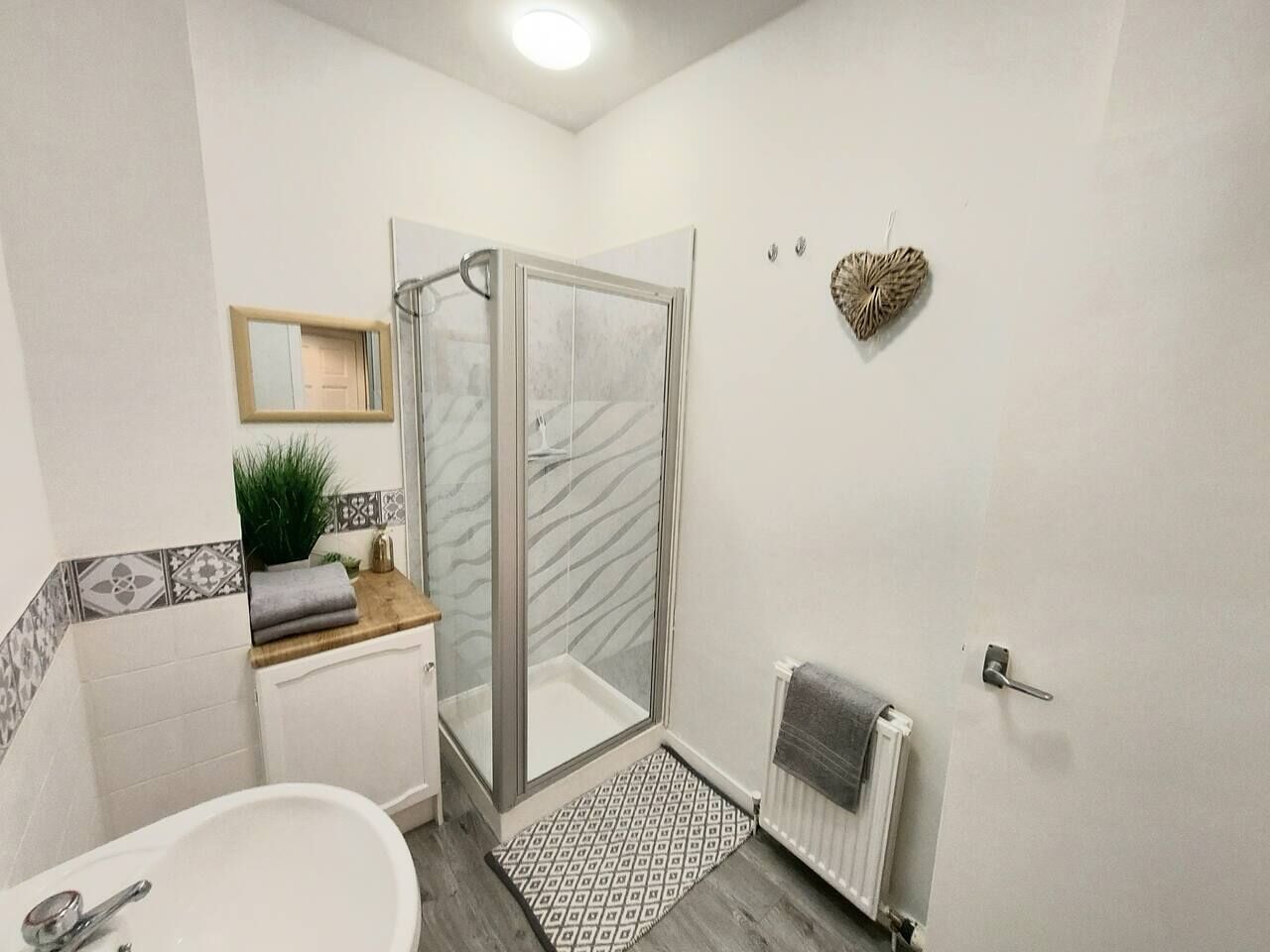 Shower, hair dryer, towels, toilet paper