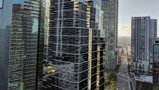 A high-rise building with a modern glass facade, surrounded by other tall buildings. - Ocean & City Views Lux Miami Brickell | Sleeps 5 (Miami)