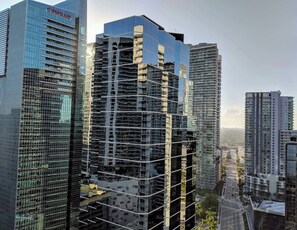 A high-rise building with a modern glass facade, surrounded by other tall buildings. - Ocean & City Views Lux Miami Brickell | Sleeps 5 (Miami)