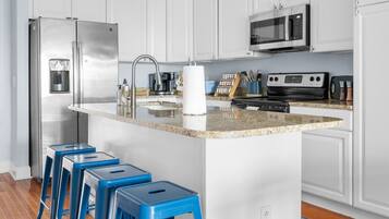 Fridge, coffee/tea maker, cookware/dishes/utensils