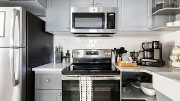 Fridge, coffee/tea maker, cookware/dishes/utensils