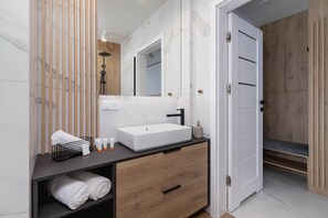Shower, hair dryer, towels, shampoo