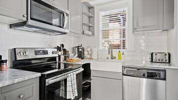 Fridge, microwave, stovetop, coffee/tea maker