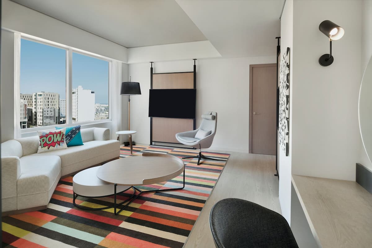 Breezy, Suite, 1 King Bed, Non Smoking, City View | Living room | 60-inch LED TV with satellite channels, TV