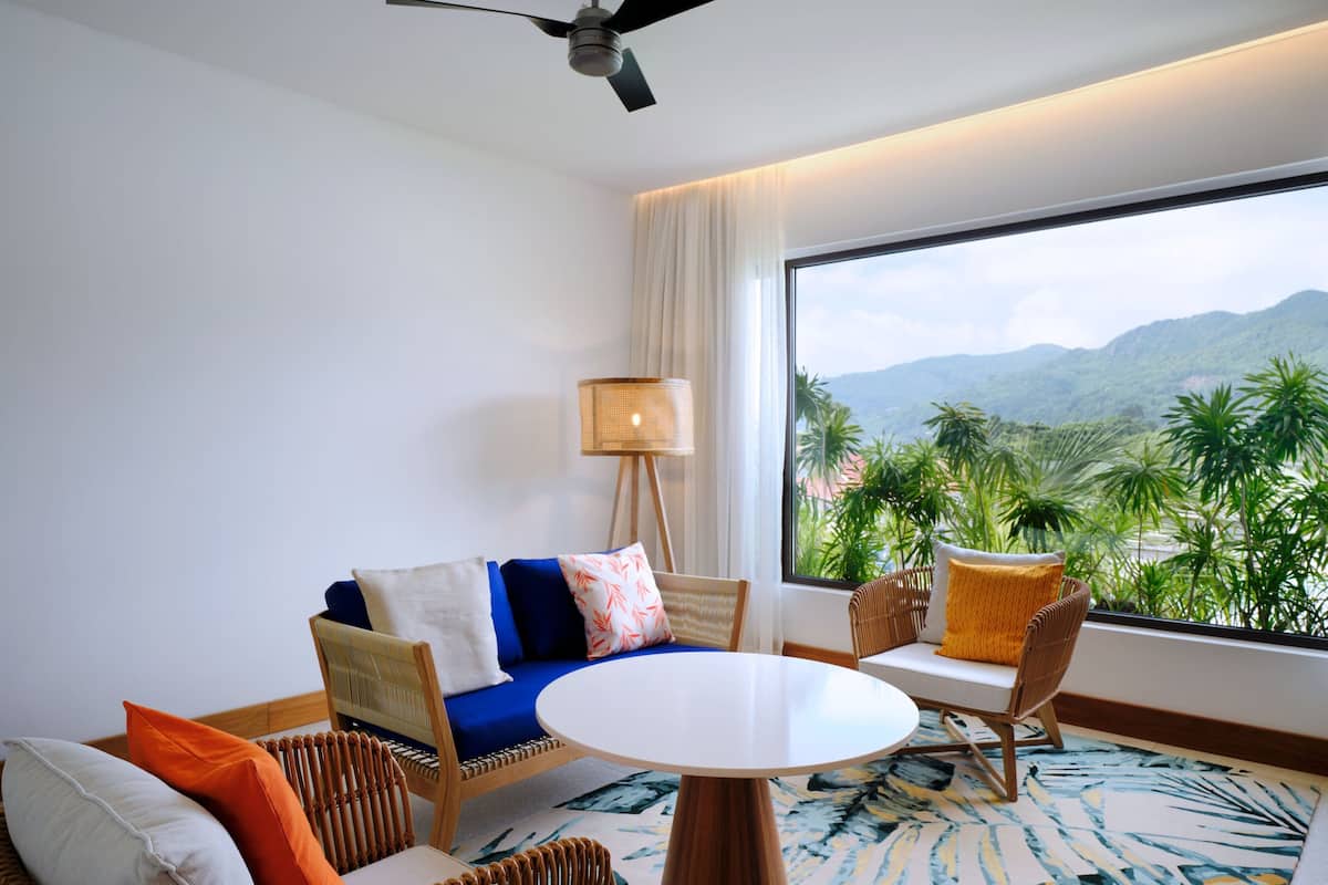 Family Suite, 1 Bedroom, Non Smoking, Mountain View | 1 bedroom, minibar, in-room safe, individually decorated