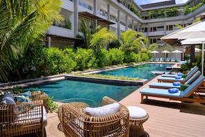 Outdoor pool, pool umbrellas, pool loungers