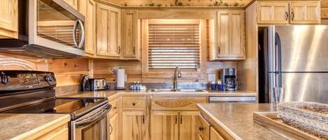 Réfrigérateur, four à micro-ondes, lave-vaisselle, cafetiÚre-théiÚre