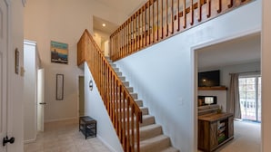 A staircase with wooden railings leading to an upper level. - Riverwood at Mill Ridge - hot tub, arcades, firepit along Watauga River, walk to pool, tennis (Banner Elk)