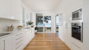 Fridge, microwave, oven, stovetop - Foreshore Beach House - Stunning waterfront home (Salamander Bay)