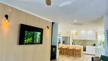 Smart TV, fireplace, books, printers