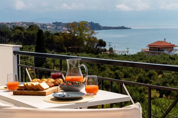 Start Your Day with a Delicious Breakfast by the Pool – A serene morning setup with views and sunshine.