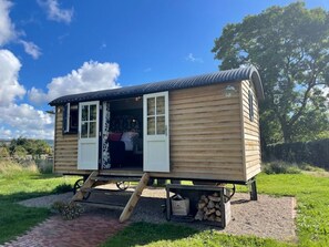 A small wooden cabin with a porch, a door, and a window. - Romantic Escape with Hot Tub, Barnard Castle (Barnard Castle)