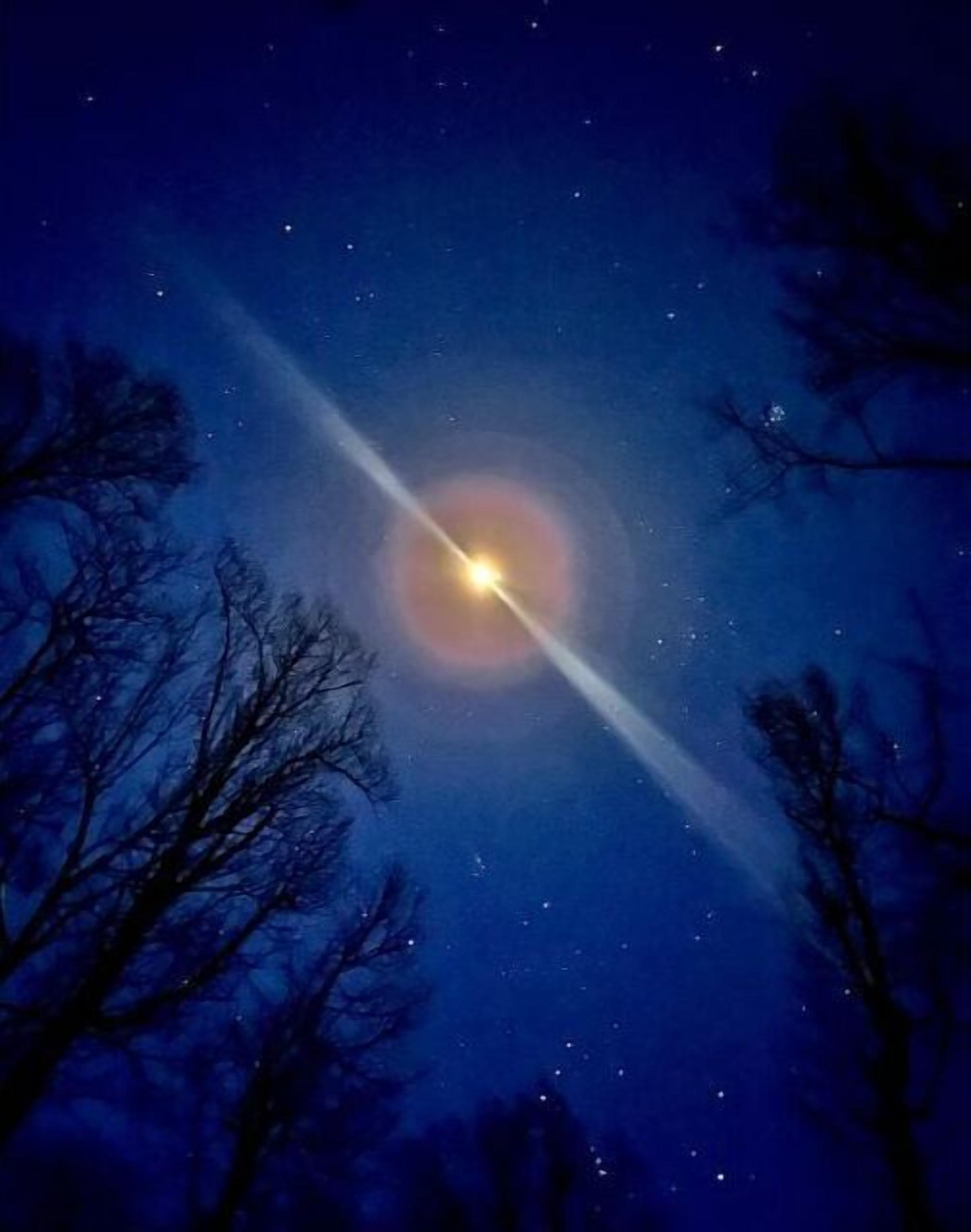 A starry night sky with a visible light trail.