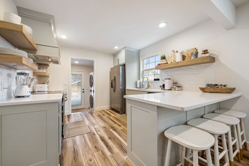 Dog-friendly home with a firepit, yard, washer/dryer, central AC & game room