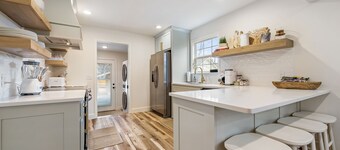 Dog-friendly home with a firepit, yard, washer/dryer, central AC & game room